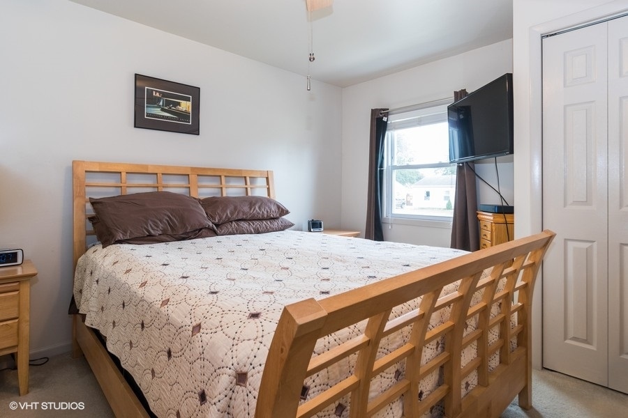 228 Murphy Drive Romeoville, IL 60446 - Photo 9 of 20 a bedroom with a bed and a window