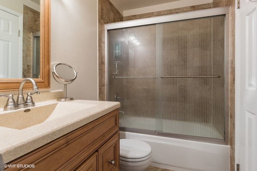 228 Murphy Drive Romeoville, IL 60446 - Photo 10 of 20 a bathroom with a sink a toilet and shower