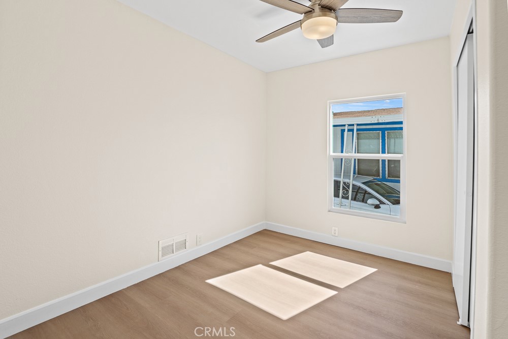 20401 Soledad Canyon Road, Unit 355 Canyon Country, CA 91351 - Photo 11 of 36 an empty room with a window and a ceiling fan