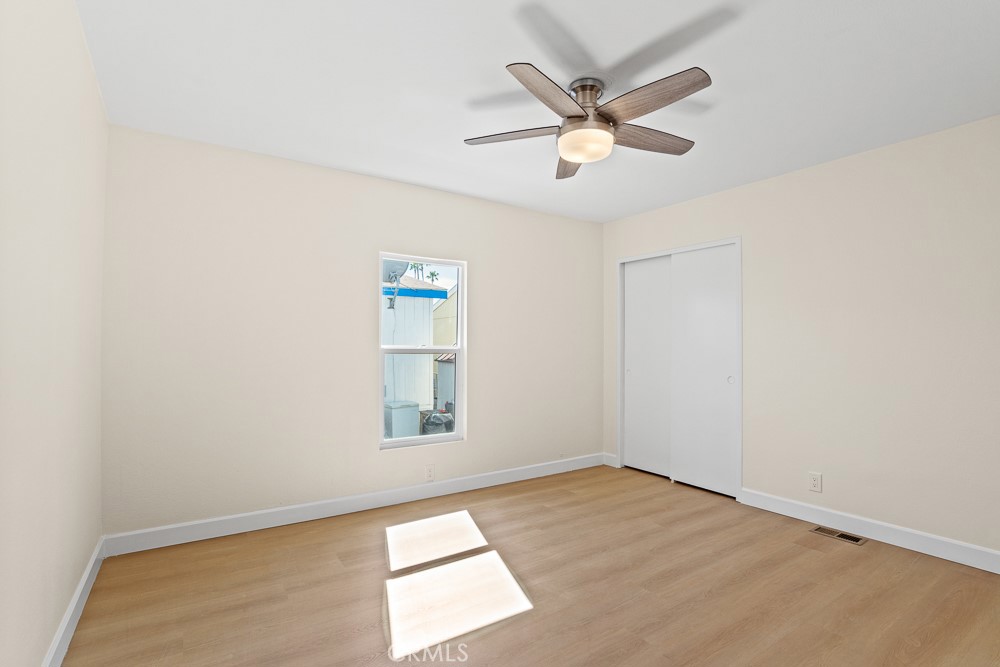 20401 Soledad Canyon Road, Unit 355 Canyon Country, CA 91351 - Photo 12 of 36 an empty room with window and ceiling fan