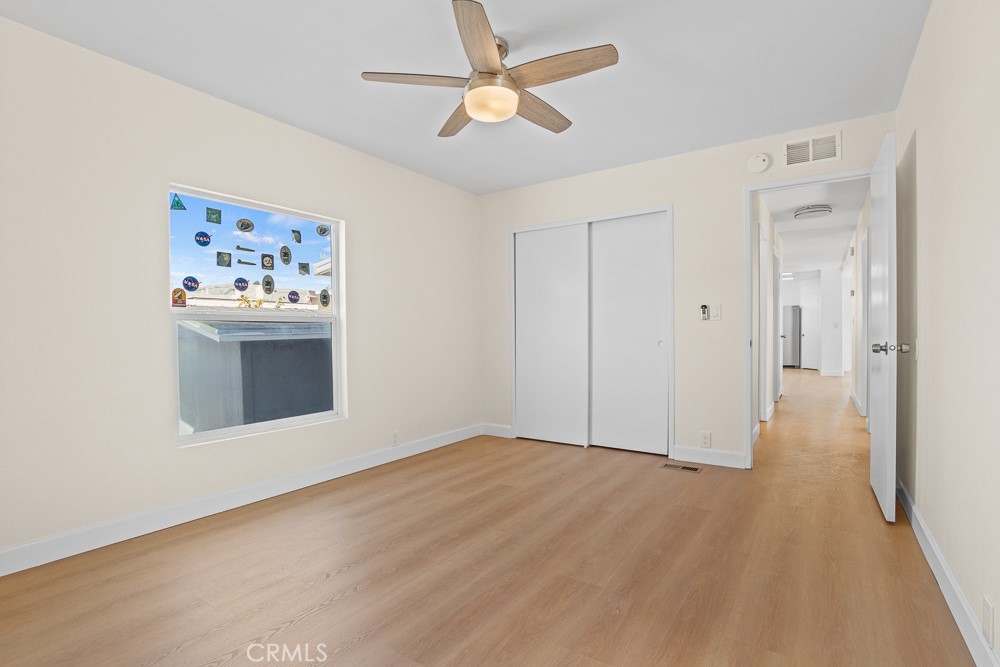 20401 Soledad Canyon Road, Unit 355 Canyon Country, CA 91351 - Photo 15 of 36 wooden floor in an empty room
