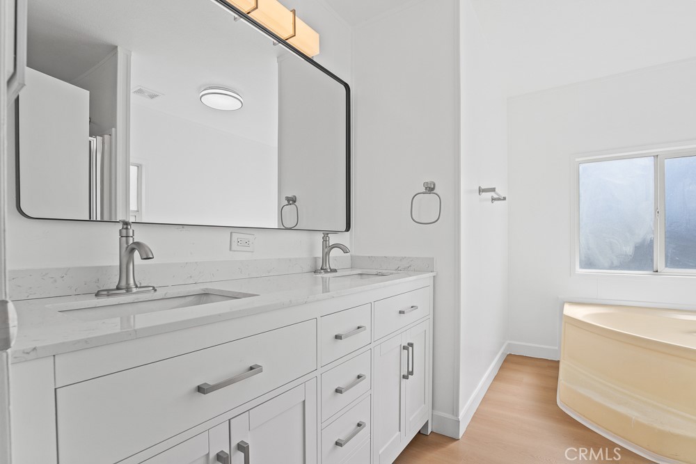 20401 Soledad Canyon Road, Unit 355 Canyon Country, CA 91351 - Photo 16 of 36 a bathroom with a sink and a mirror