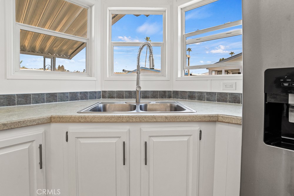20401 Soledad Canyon Road, Unit 355 Canyon Country, CA 91351 - Photo 4 of 36 a kitchen with stainless steel appliances granite countertop a sink and a window