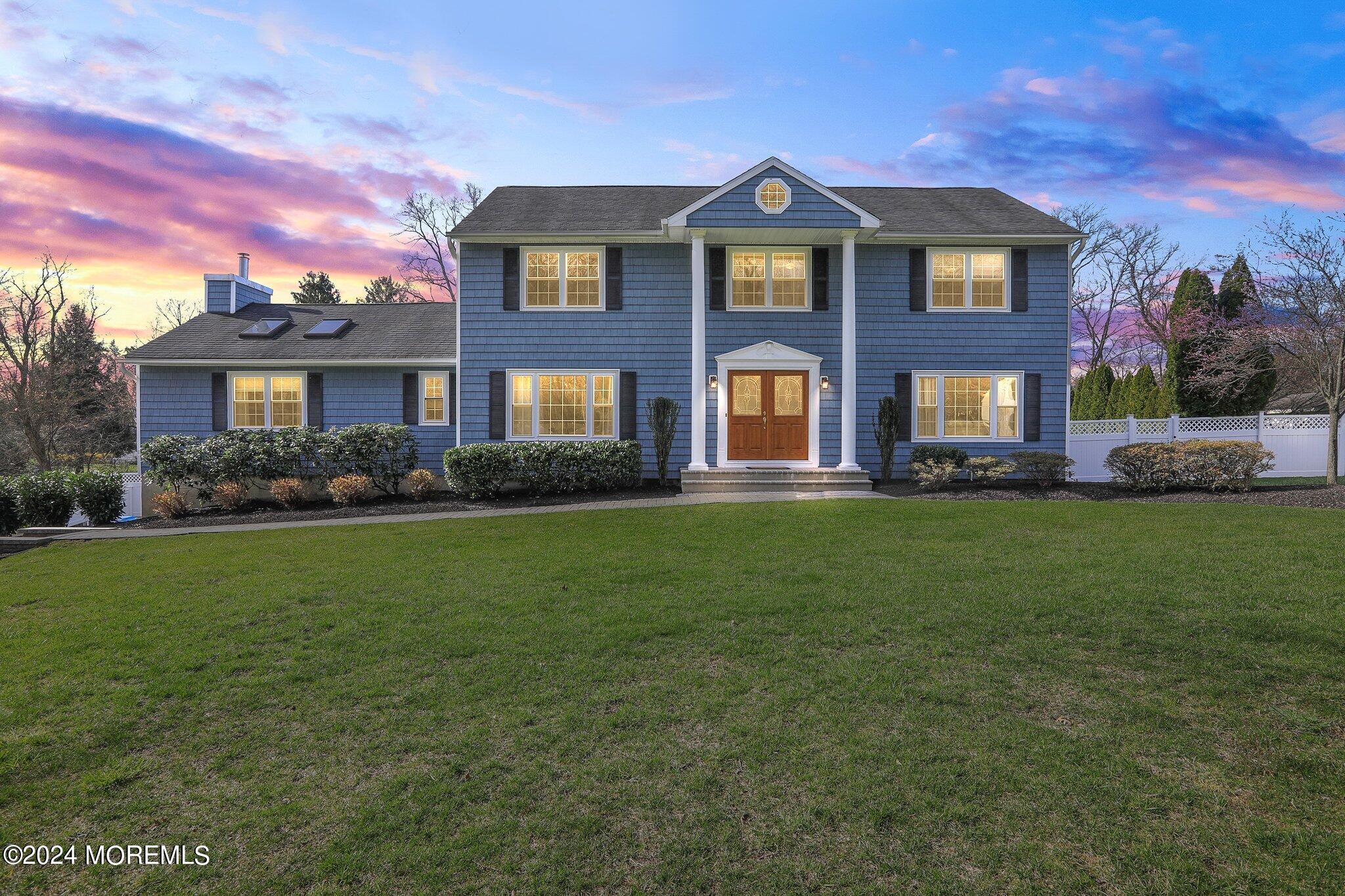 234 Yale Drive Lincroft, NJ 07738 - Photo 1 of 38 a front view of a house with a garden