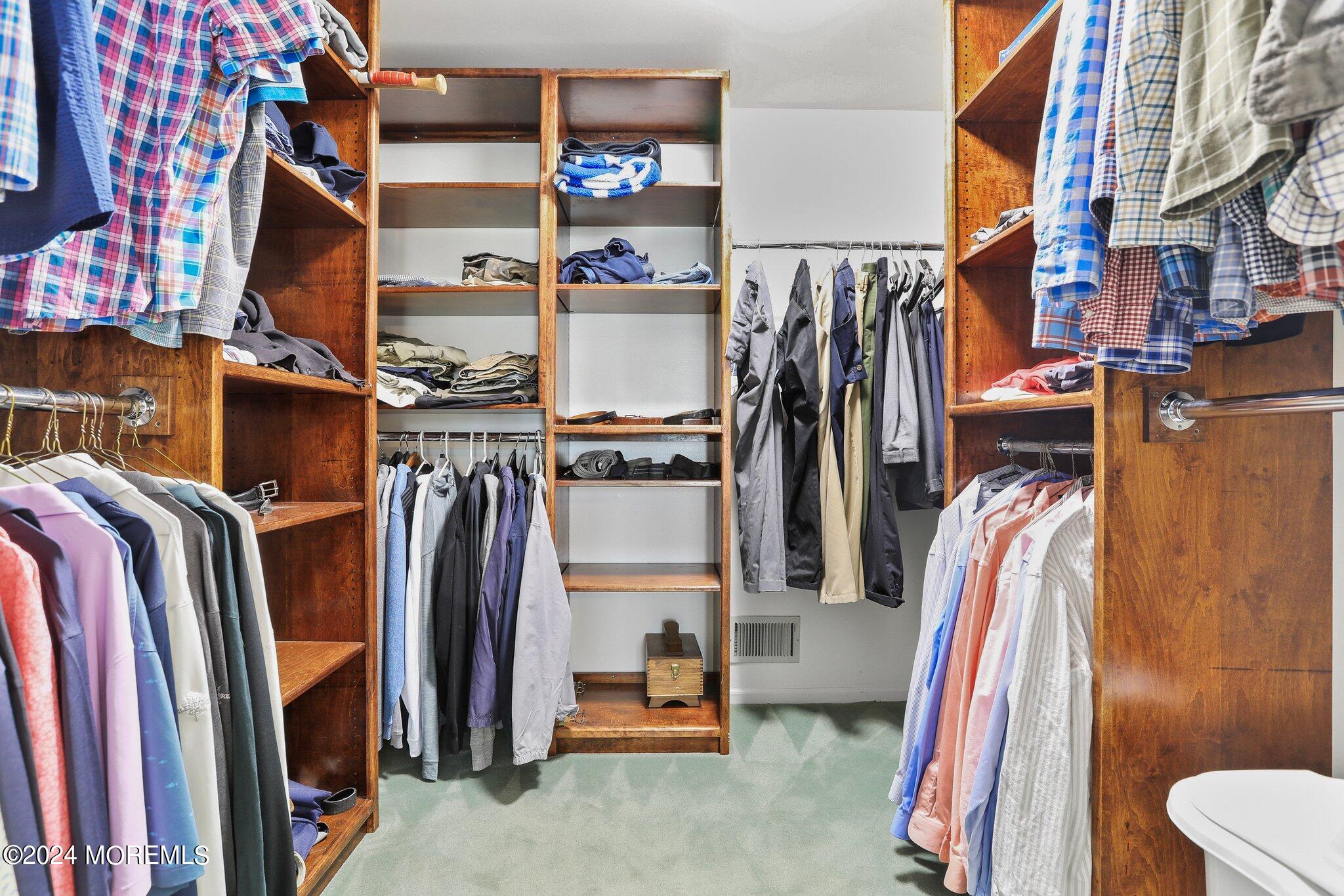 234 Yale Drive Lincroft, NJ 07738 - Photo 24 of 38 a view of walk in closet with clothes and shoes