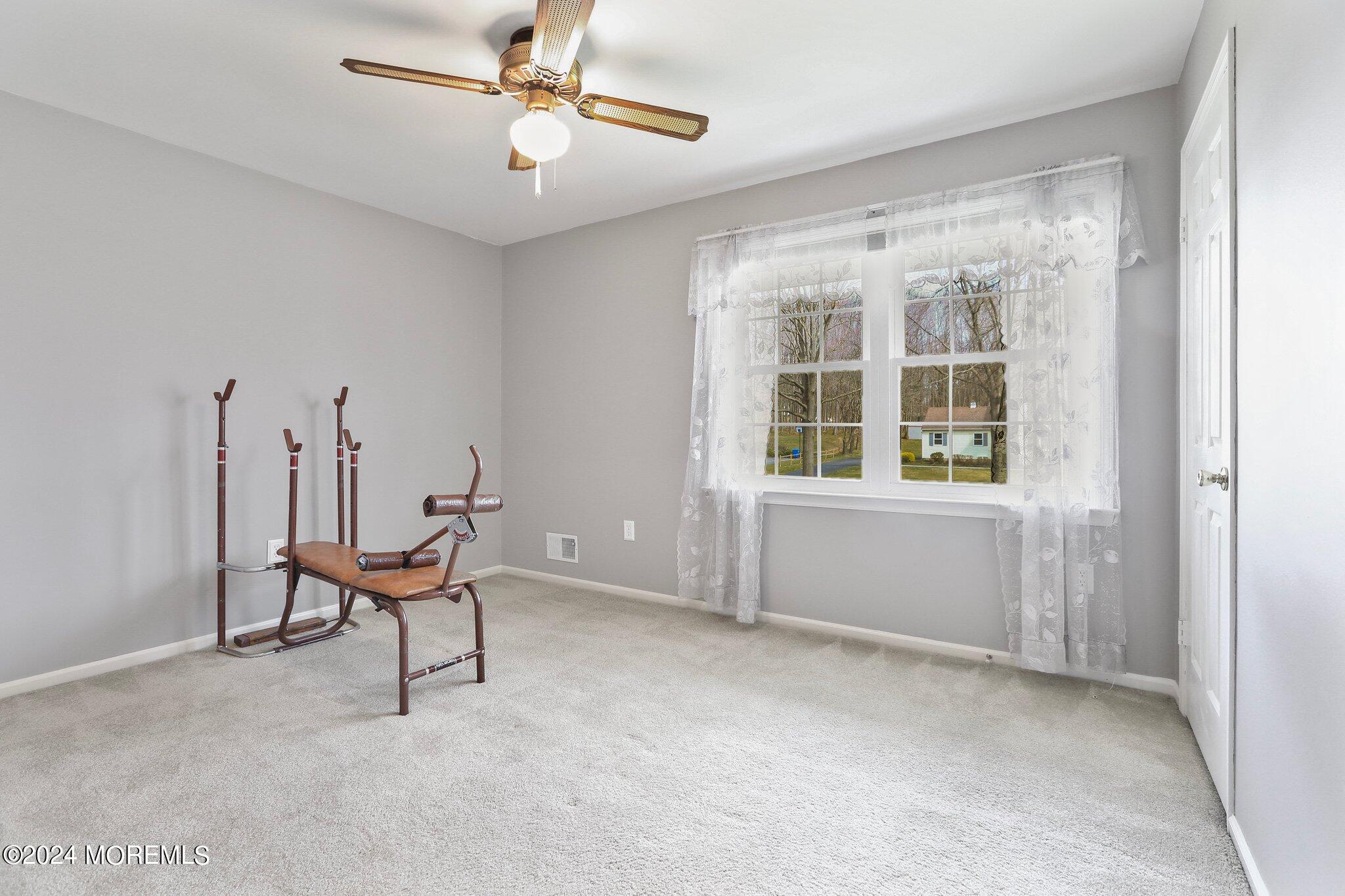 234 Yale Drive Lincroft, NJ 07738 - Photo 28 of 38 a living room with furniture and a window