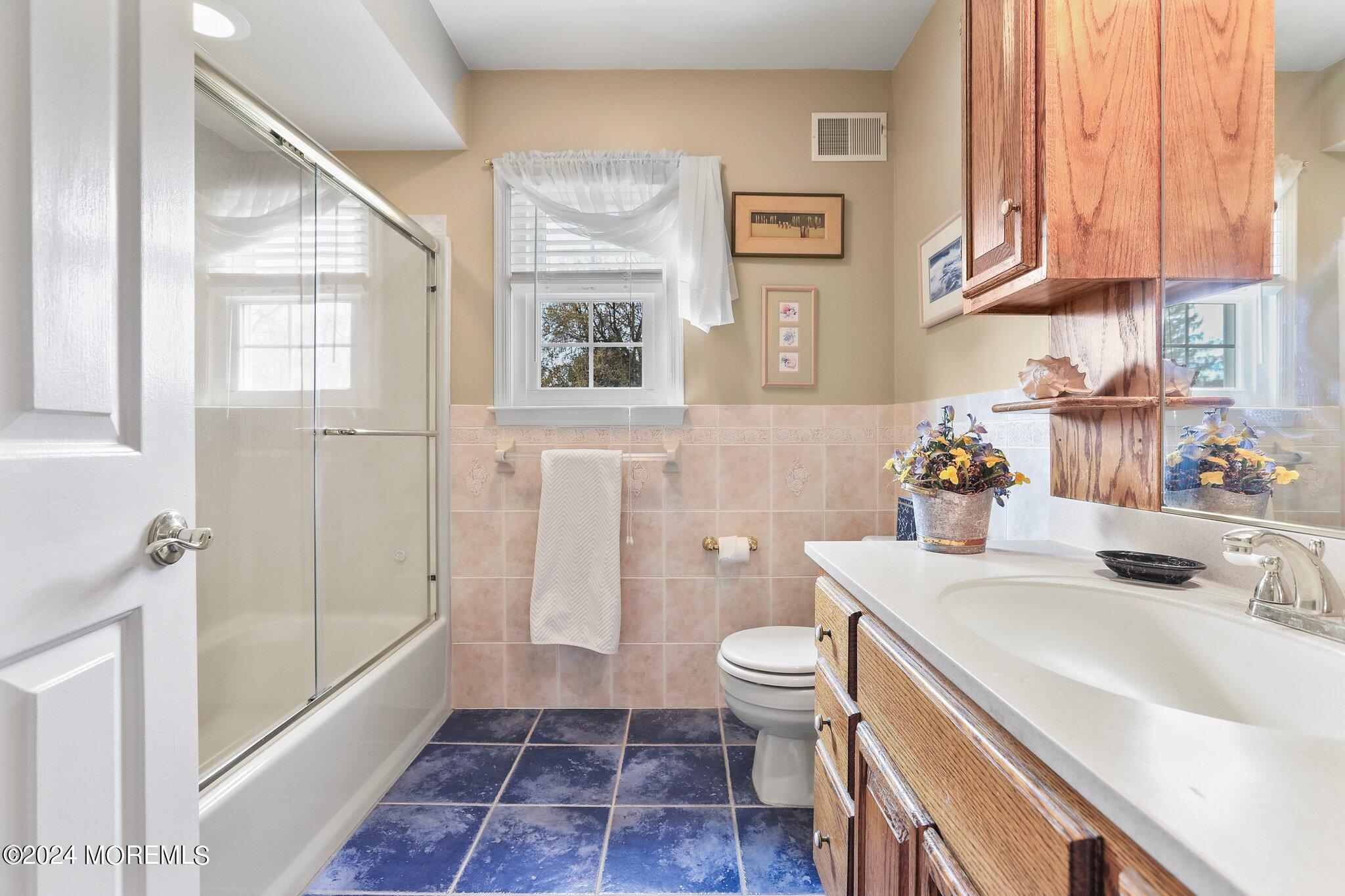 234 Yale Drive Lincroft, NJ 07738 - Photo 29 of 38 a bathroom with a sink a toilet and shower
