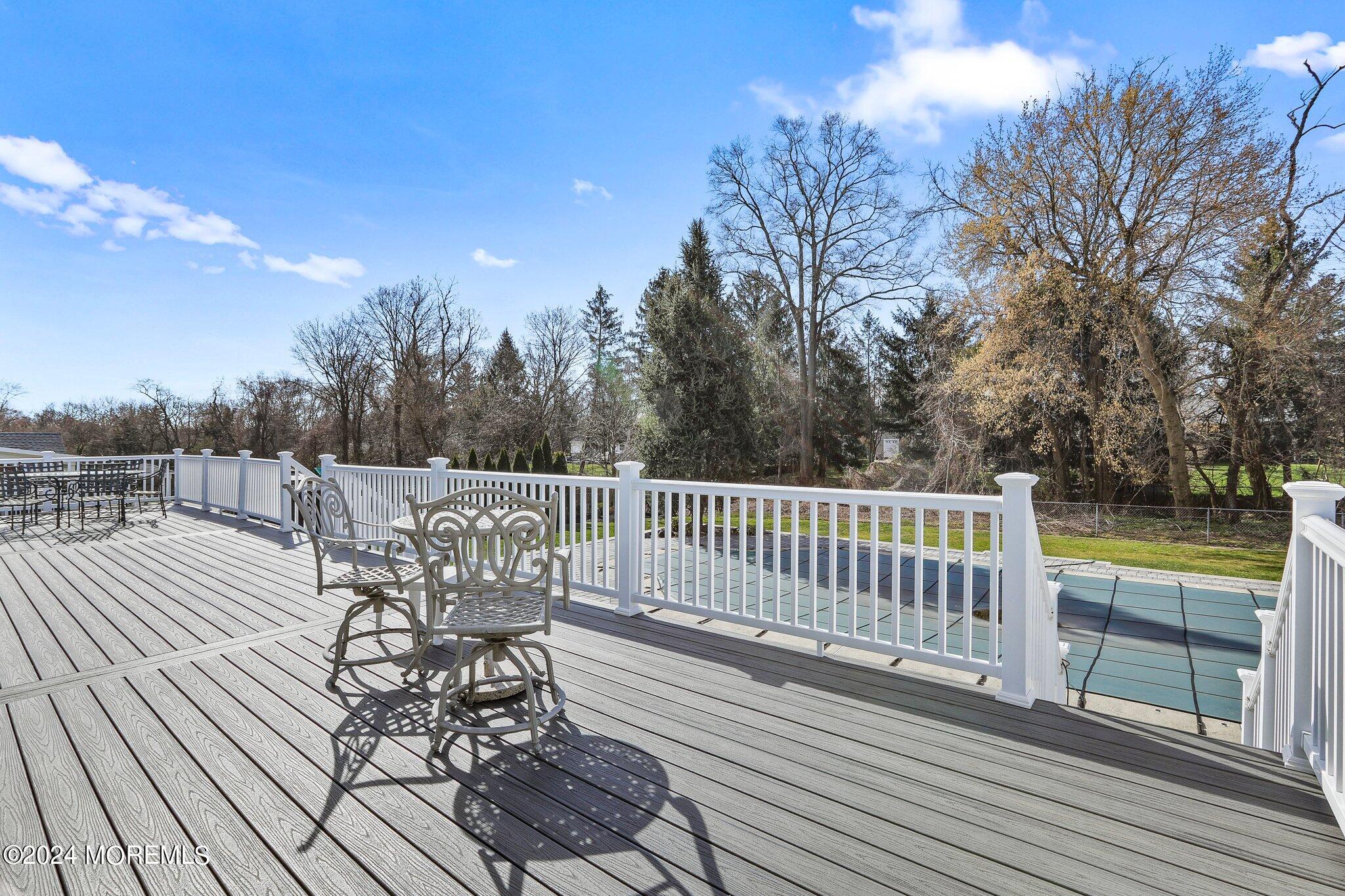 234 Yale Drive Lincroft, NJ 07738 - Photo 31 of 38 a view of balcony with deck and outdoor seating