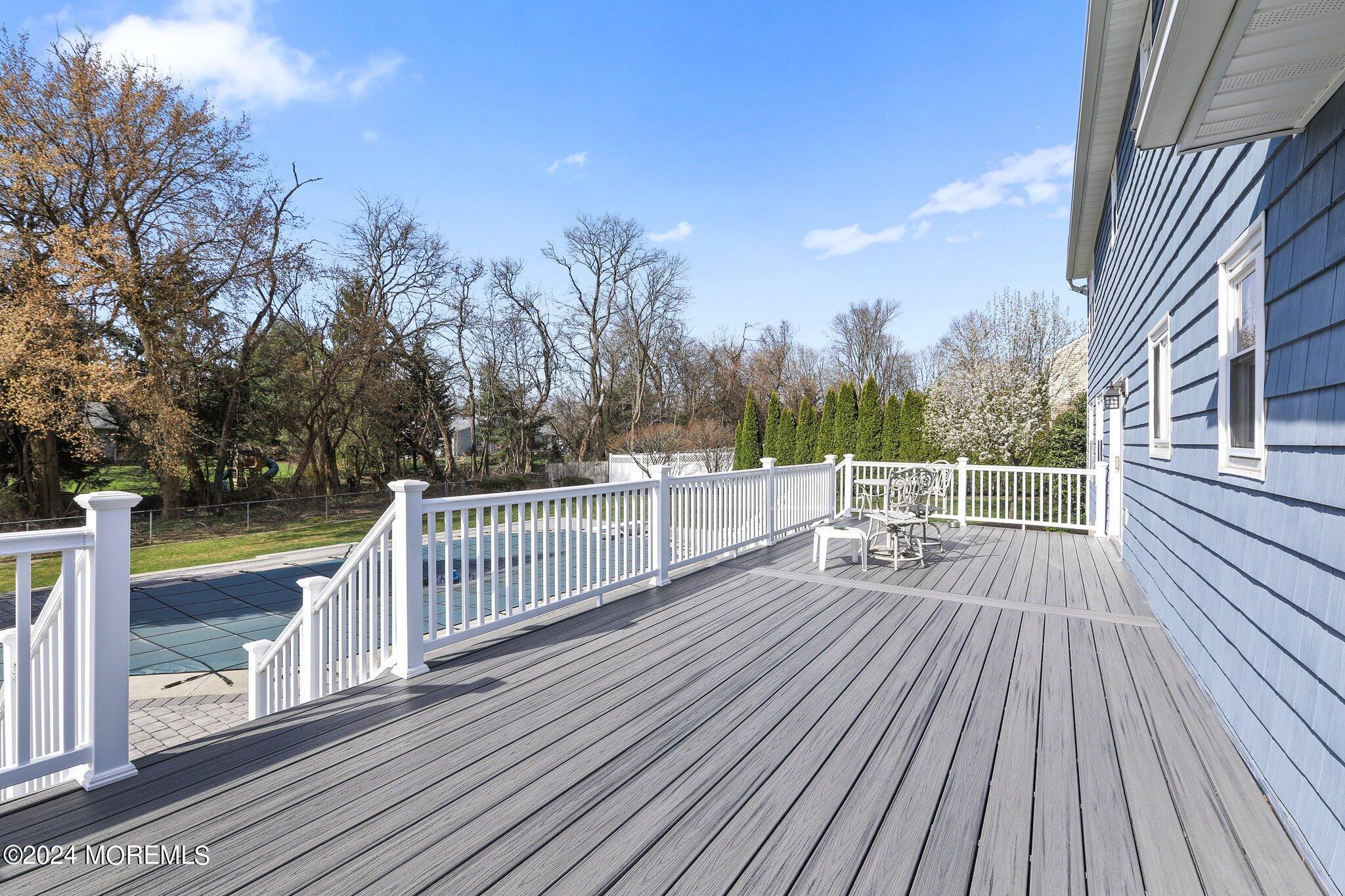 234 Yale Drive Lincroft, NJ 07738 - Photo 32 of 38 a view of balcony with deck and wooden floor