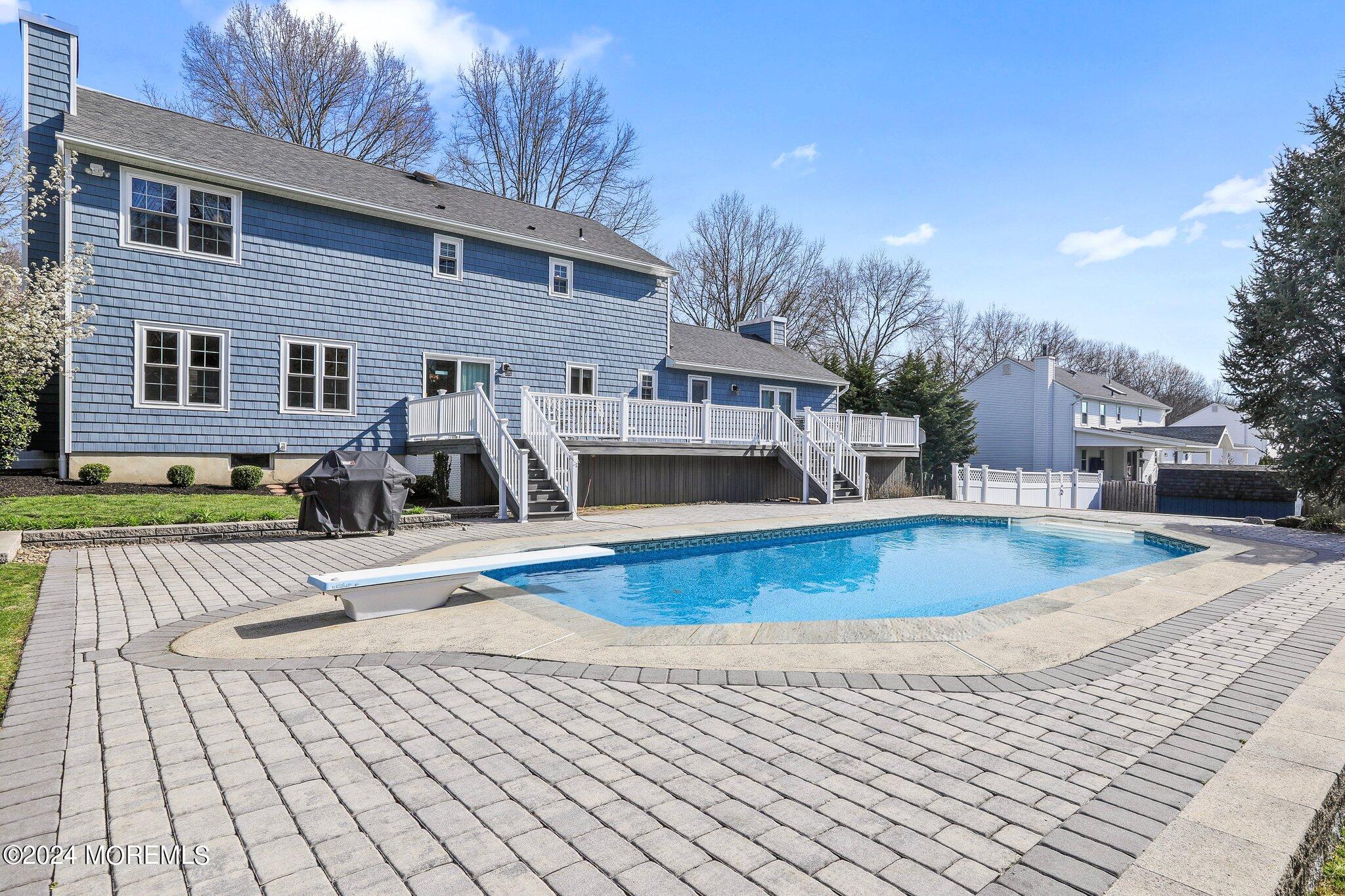 234 Yale Drive Lincroft, NJ 07738 - Photo 33 of 38 a view of a house with swimming pool