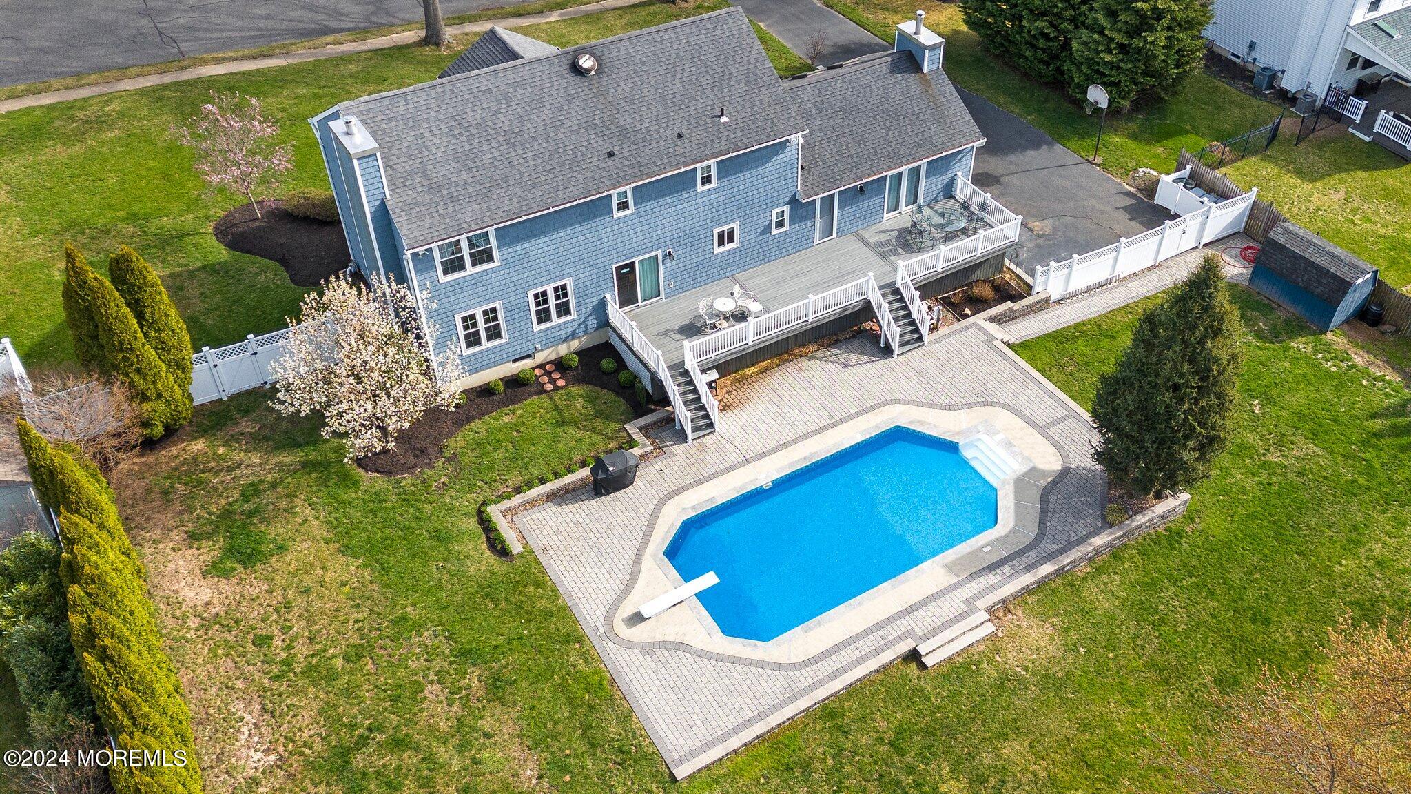 234 Yale Drive Lincroft, NJ 07738 - Photo 37 of 38 an aerial view of a house with a swimming pool