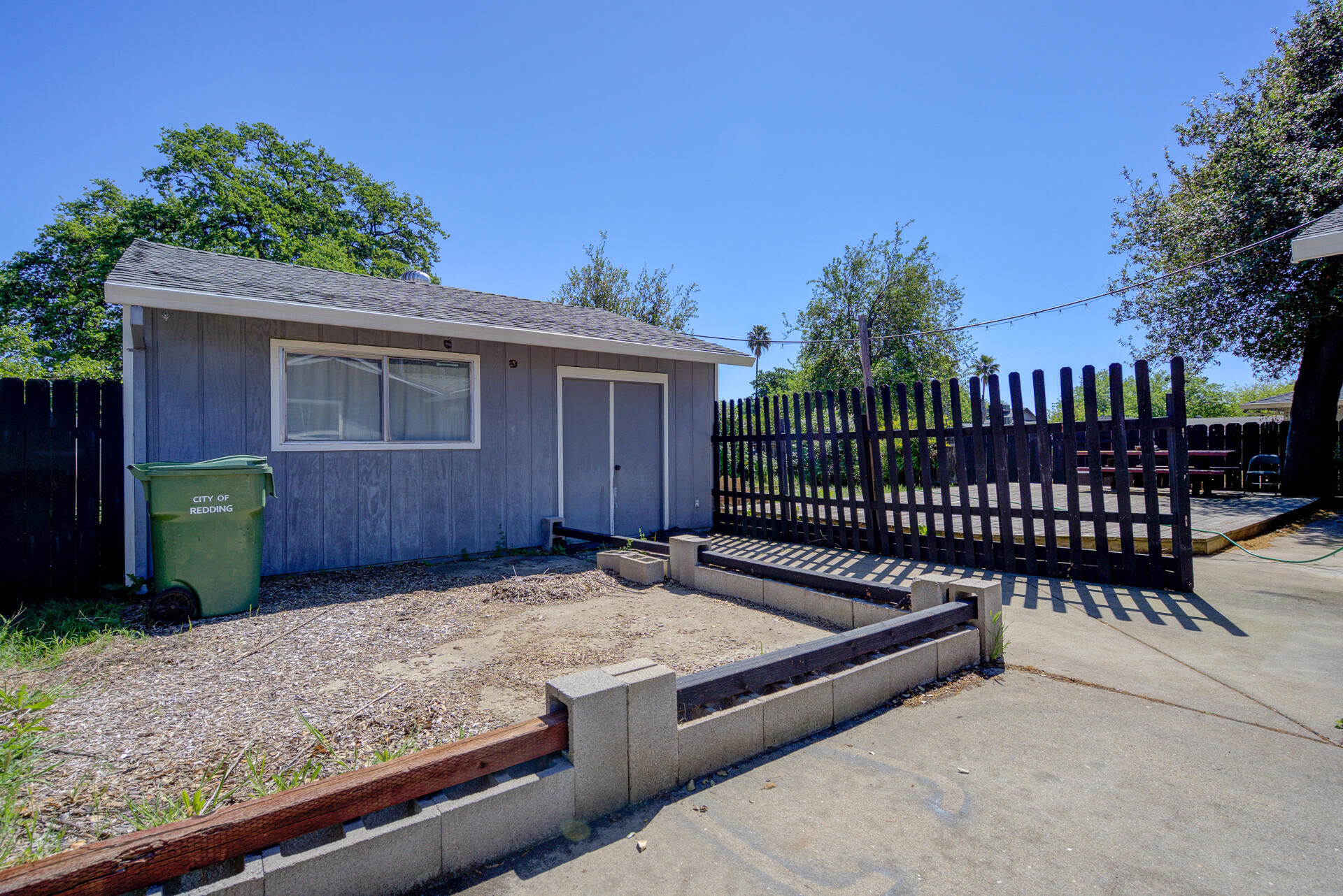 2689 Shasta View Drive Redding, CA 96002 - Photo 24 of 33 a view of a backyard with a wooden fence