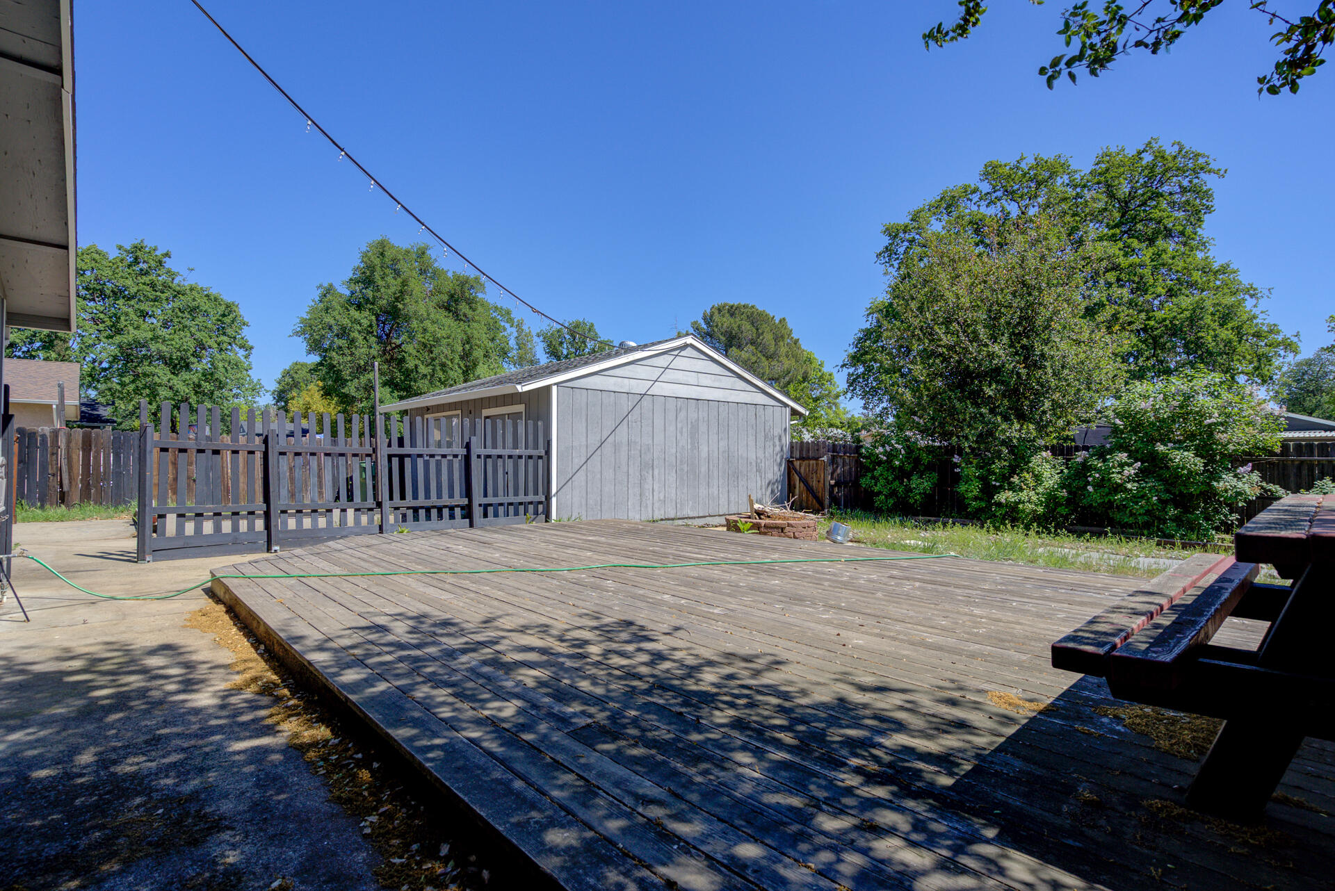 2689 Shasta View Drive Redding, CA 96002 - Photo 26 of 33 a view of a backyard with wooden fence