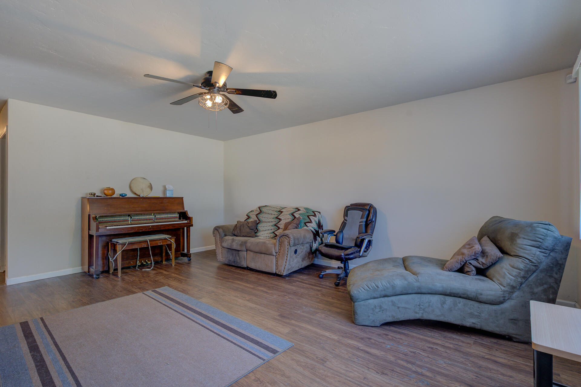 2689 Shasta View Drive Redding, CA 96002 - Photo 3 of 33 a living room with furniture a ceiling fan and a rug