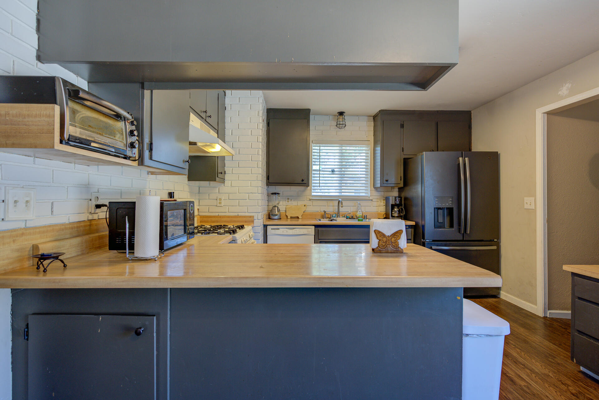 2689 Shasta View Drive Redding, CA 96002 - Photo 8 of 33 a kitchen with sink a refrigerator and wooden cabinets