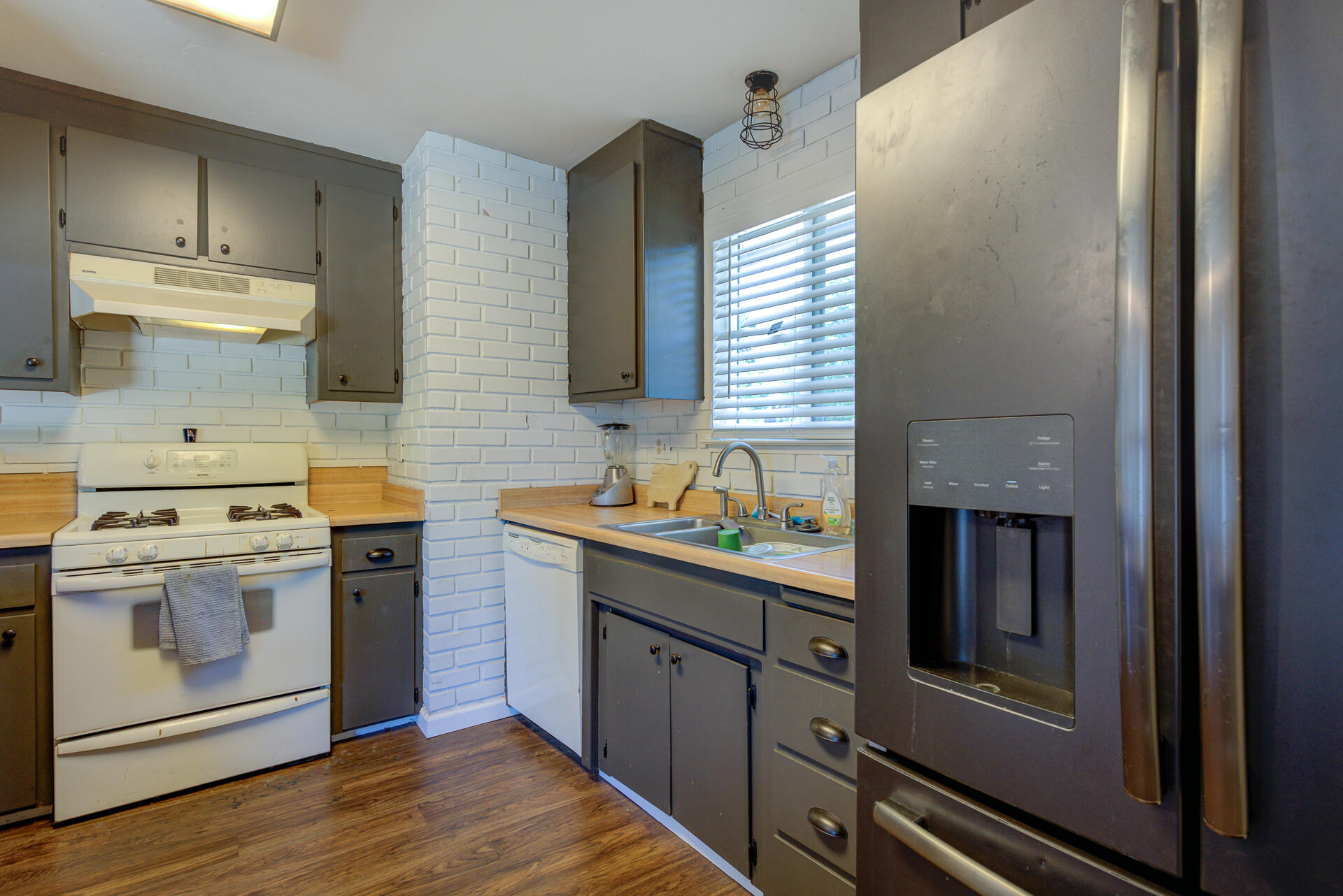 2689 Shasta View Drive Redding, CA 96002 - Photo 9 of 33 a kitchen with stainless steel appliances granite countertop a stove a sink and a refrigerator
