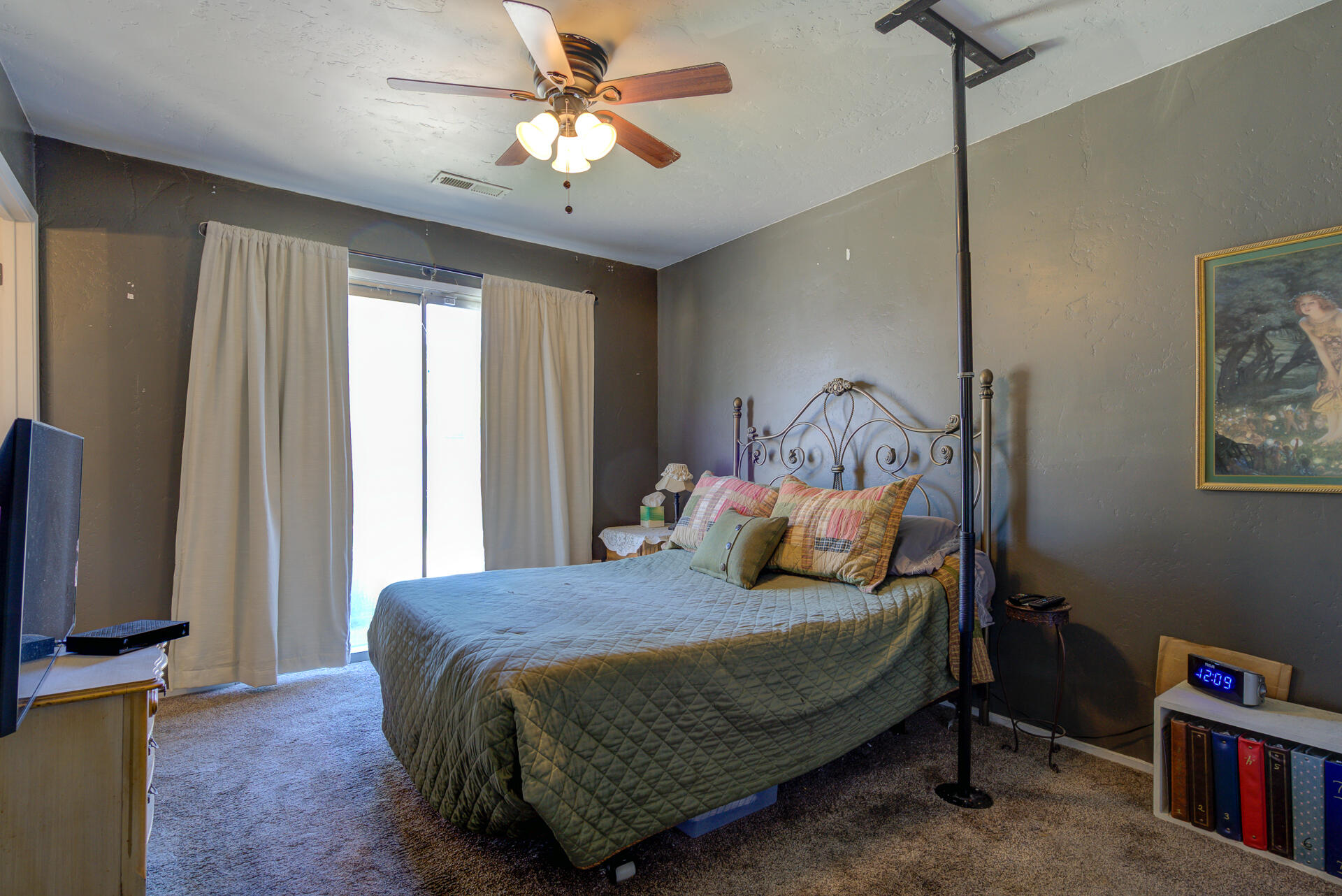 2689 Shasta View Drive Redding, CA 96002 - Photo 10 of 33 a bedroom with a bed a window and a flat screen television