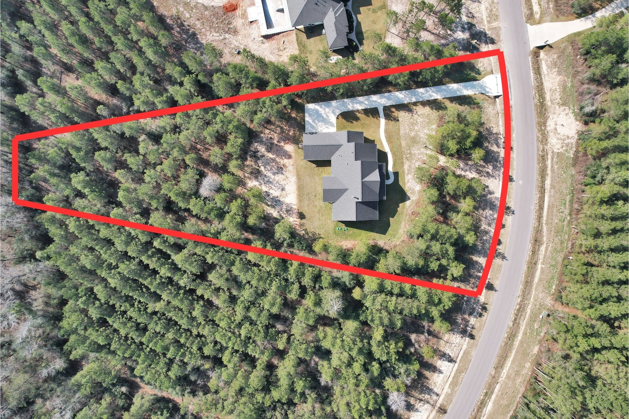 12744 Oak Barrel Road Willis, TX 77378 - Photo 43 of 50 Set on an impressive 1.65-acre homesite, this property offers an abundance of space, privacy, and natural beauty. Mature trees surround the home, creating a peaceful setting while still providing open areas to enjoy outdoor living.