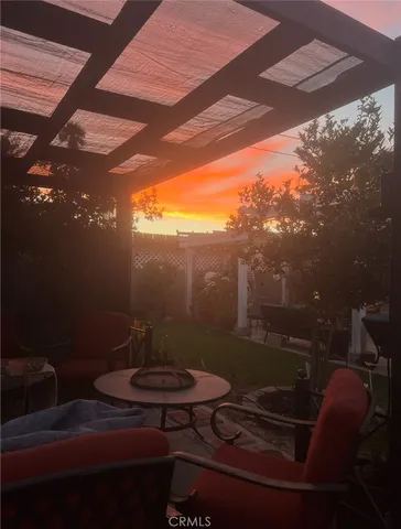 a view of a porch with furniture and yard