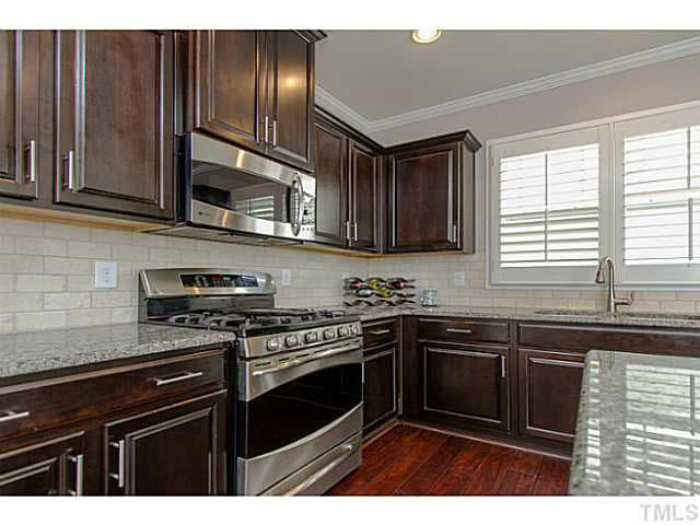 1410 Rodessa Run Raleigh, NC 27607 - Photo 9 of 25 ENJOY THE STAINLESS STEEL GAS RANGE, MICROWAVE AND DISHWASHER. Kitchen