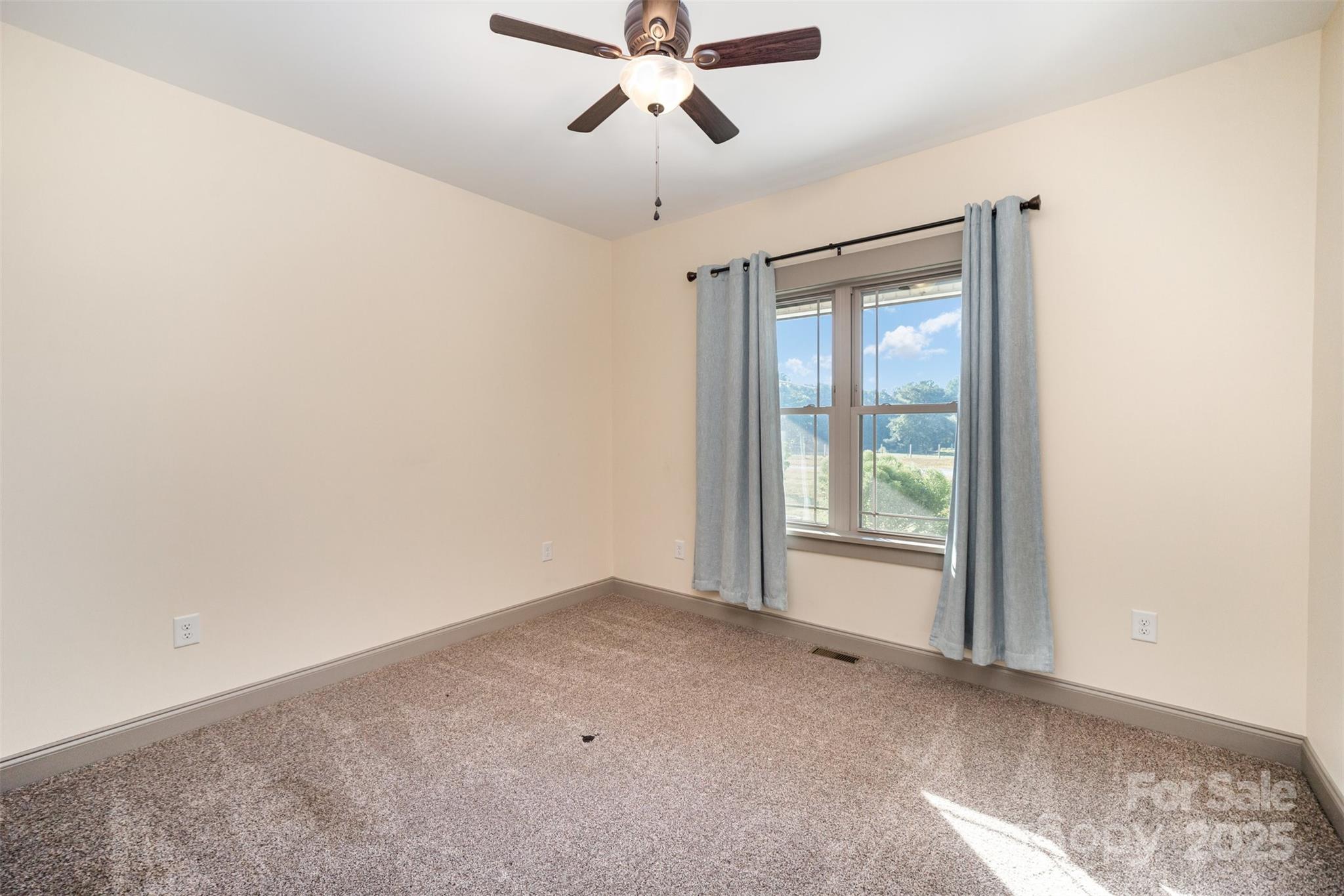 12041 Hazard Road Oakboro, NC 28129 - Photo 16 of 19 a view of an empty room with a window