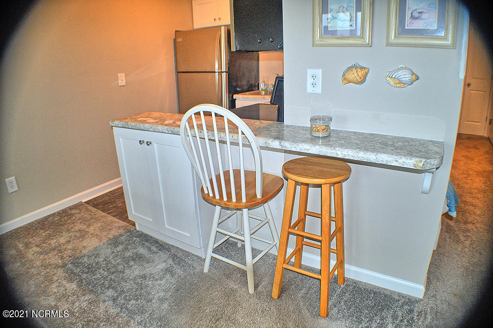 2264 New River Inlet Road, Unit 106 North Topsail Beach, NC 28460 - Photo 9 of 18 Kitchen Bar Seating