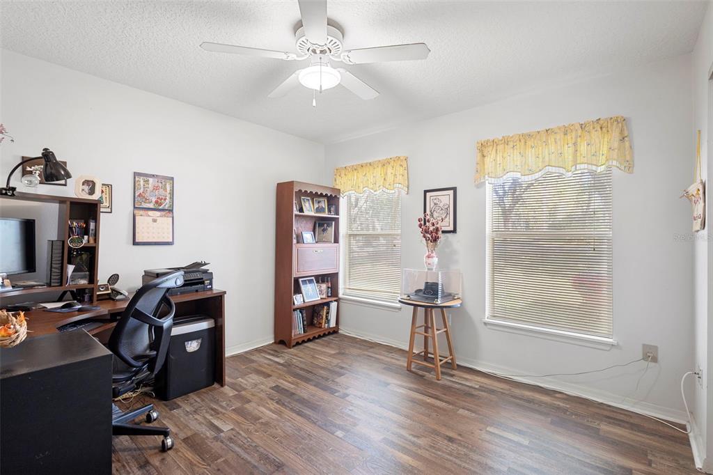 10320 Bumblebee Lane Leesburg, FL 34788 - Photo 25 of 49 a view of a workspace with furniture and a window