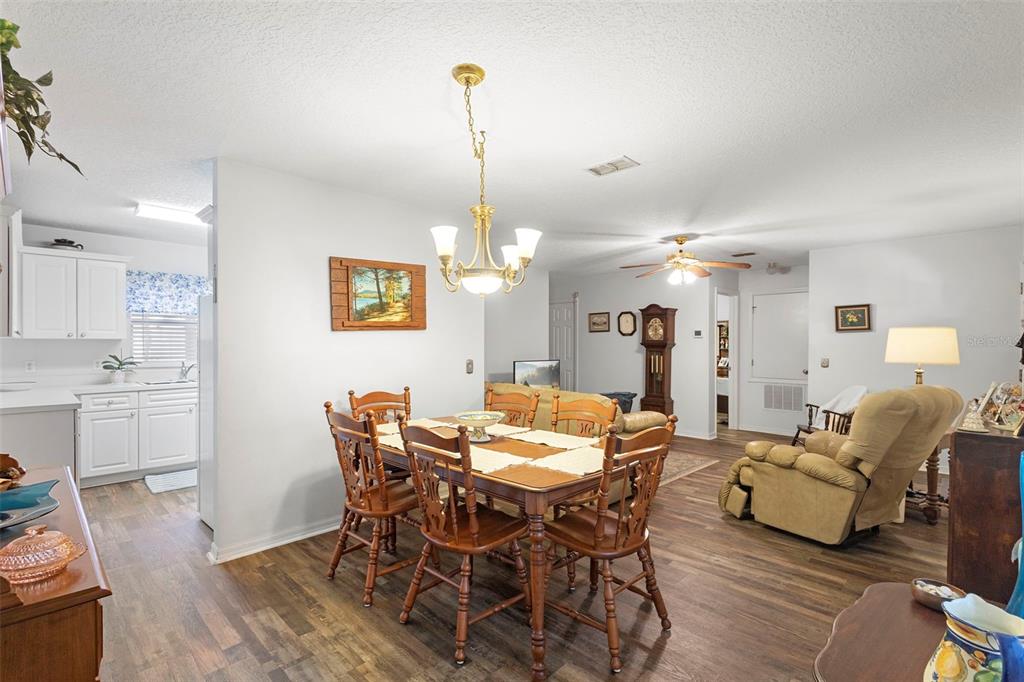 10320 Bumblebee Lane Leesburg, FL 34788 - Photo 27 of 49 a view of a dining room with furniture