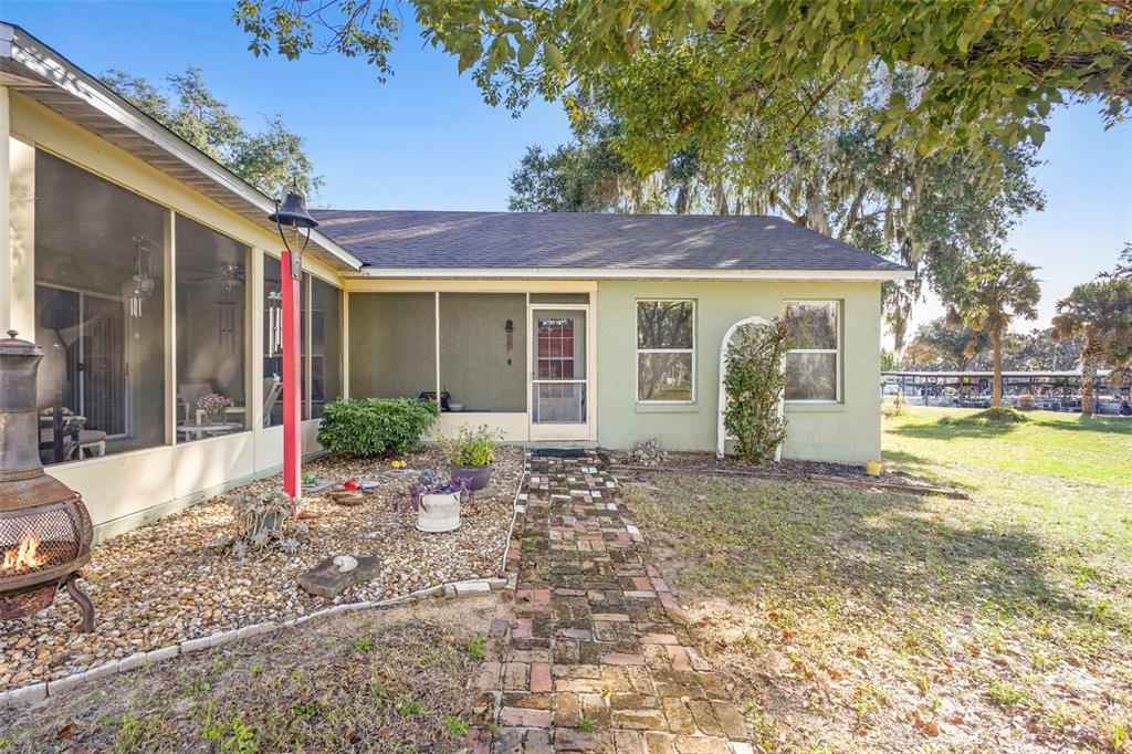 10320 Bumblebee Lane Leesburg, FL 34788 - Photo 39 of 49 a view of a house with a yard