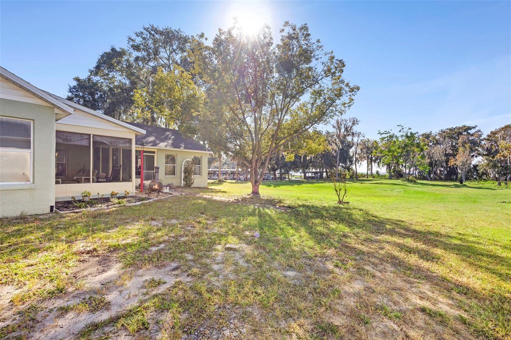 10320 Bumblebee Lane Leesburg, FL 34788 - Photo 41 of 49 a view of a house with a swimming pool
