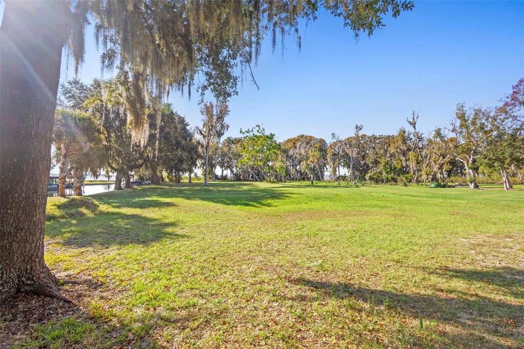 10320 Bumblebee Lane Leesburg, FL 34788 - Photo 45 of 49 a view of a swimming pool with an outdoor space and seating area