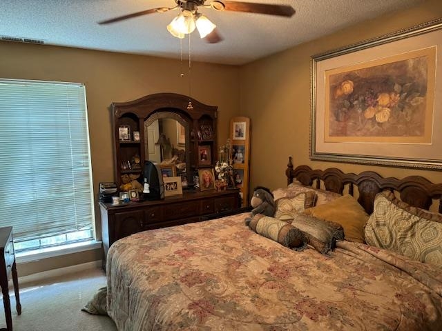 525 Walnut Bend Road Arlington, TN 38002 - Photo 11 of 15 Carpeted bedroom featuring ceiling fan and a textured ceiling