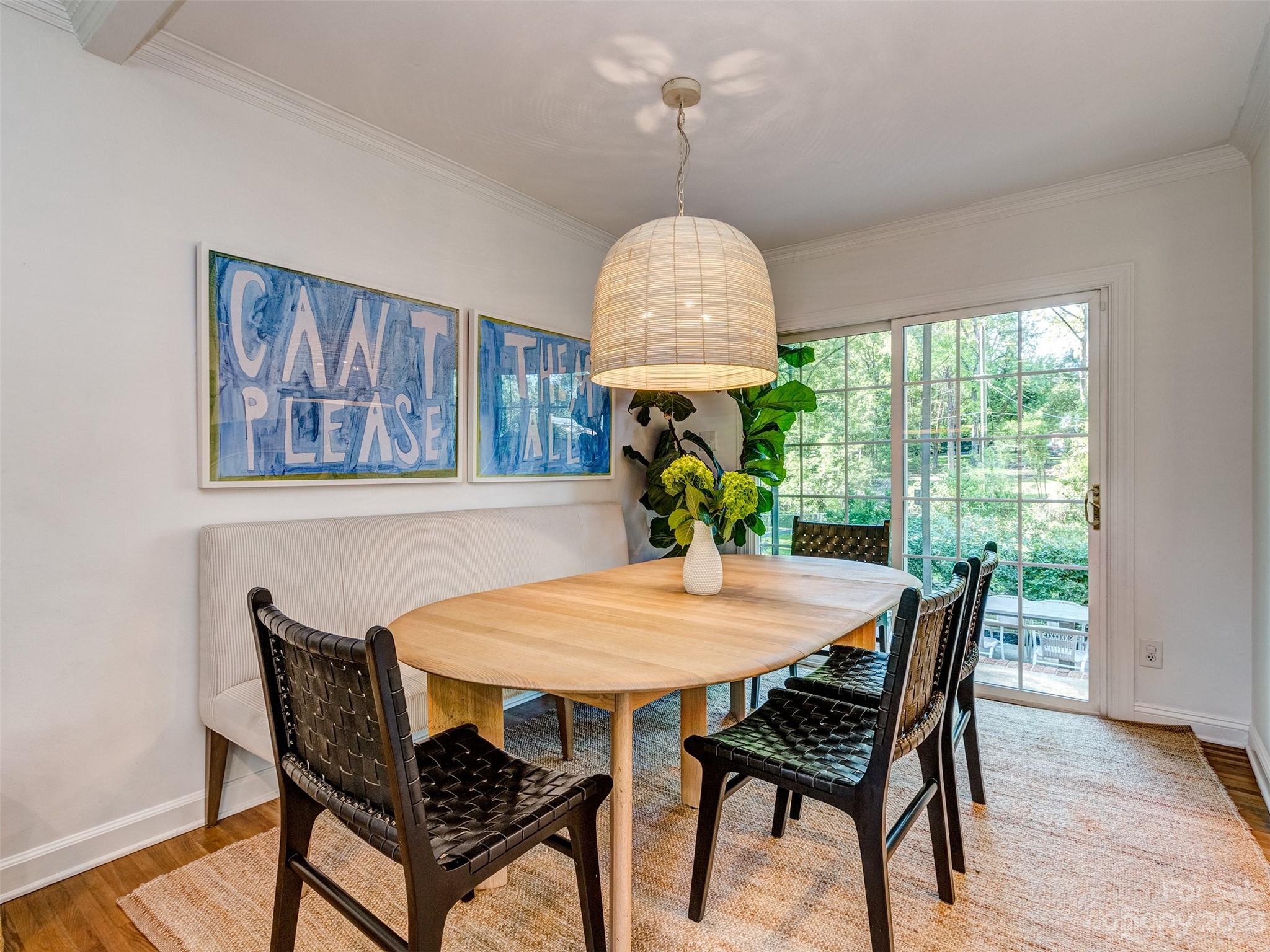 2819 Eastburn Road Charlotte, NC 28210 - Photo 11 of 34 a view of a dining room with furniture window and wooden floor
