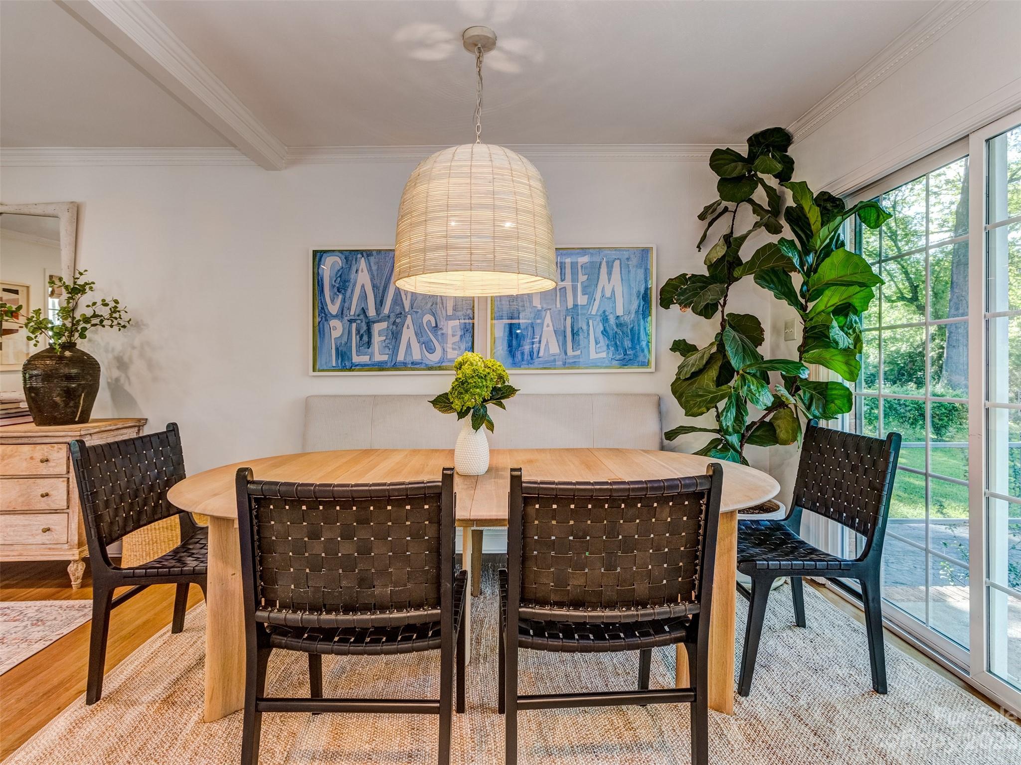 2819 Eastburn Road Charlotte, NC 28210 - Photo 12 of 34 a dining room filled chandelier and wooden floor