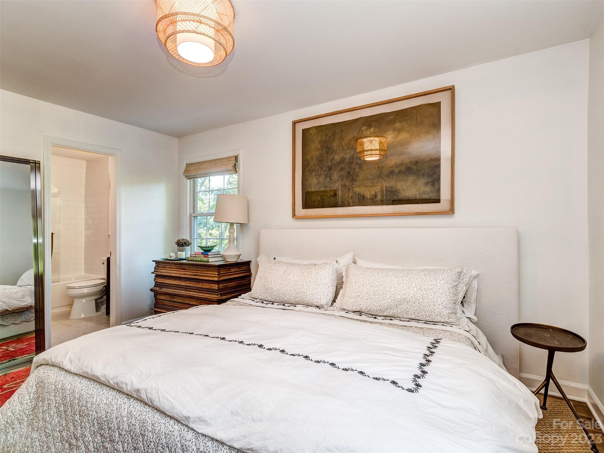 2819 Eastburn Road Charlotte, NC 28210 - Photo 15 of 34 a bedroom with a bed and wooden floor