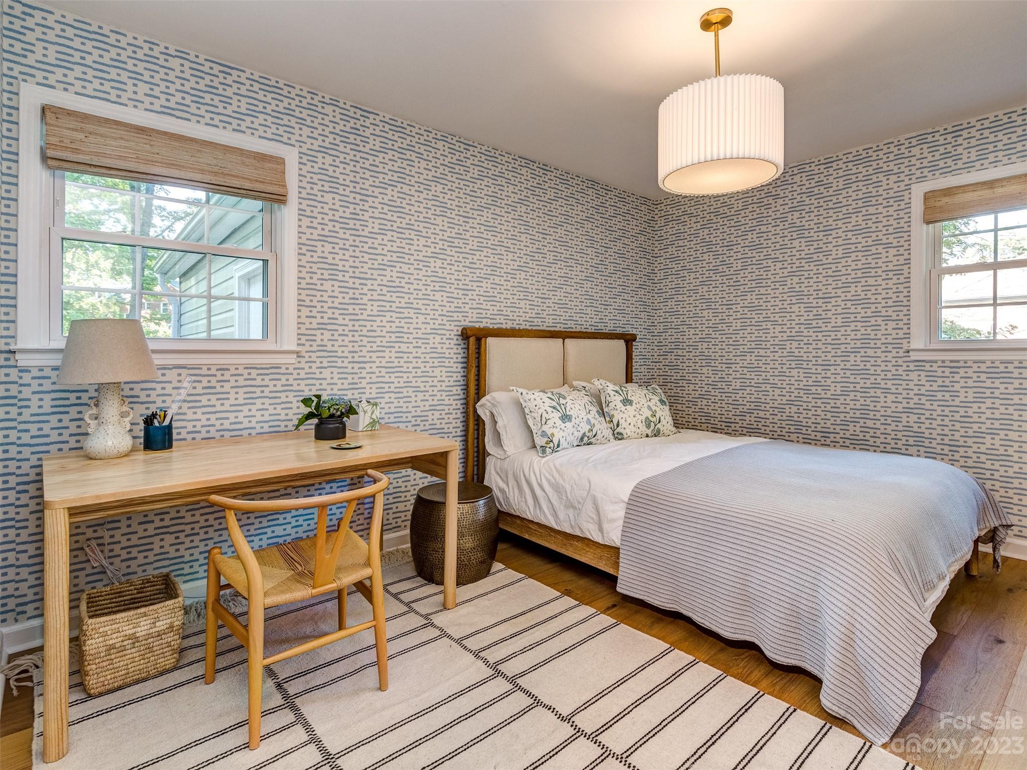 2819 Eastburn Road Charlotte, NC 28210 - Photo 23 of 34 a bedroom with a bed and a table chair