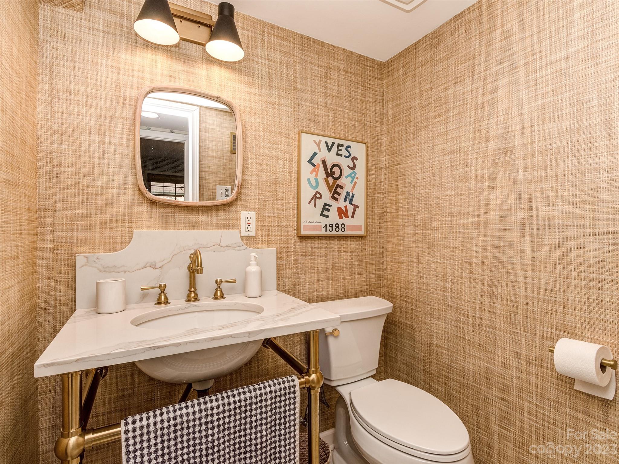 2819 Eastburn Road Charlotte, NC 28210 - Photo 24 of 34 a bathroom with a toilet sink and mirror
