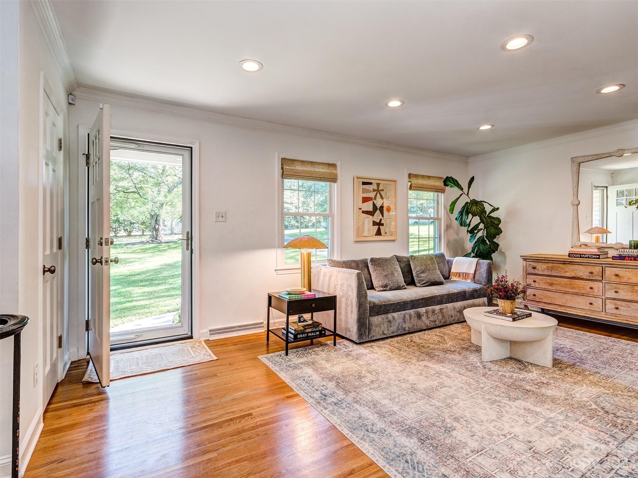 2819 Eastburn Road Charlotte, NC 28210 - Photo 4 of 34 a living room with furniture and a wooden floor