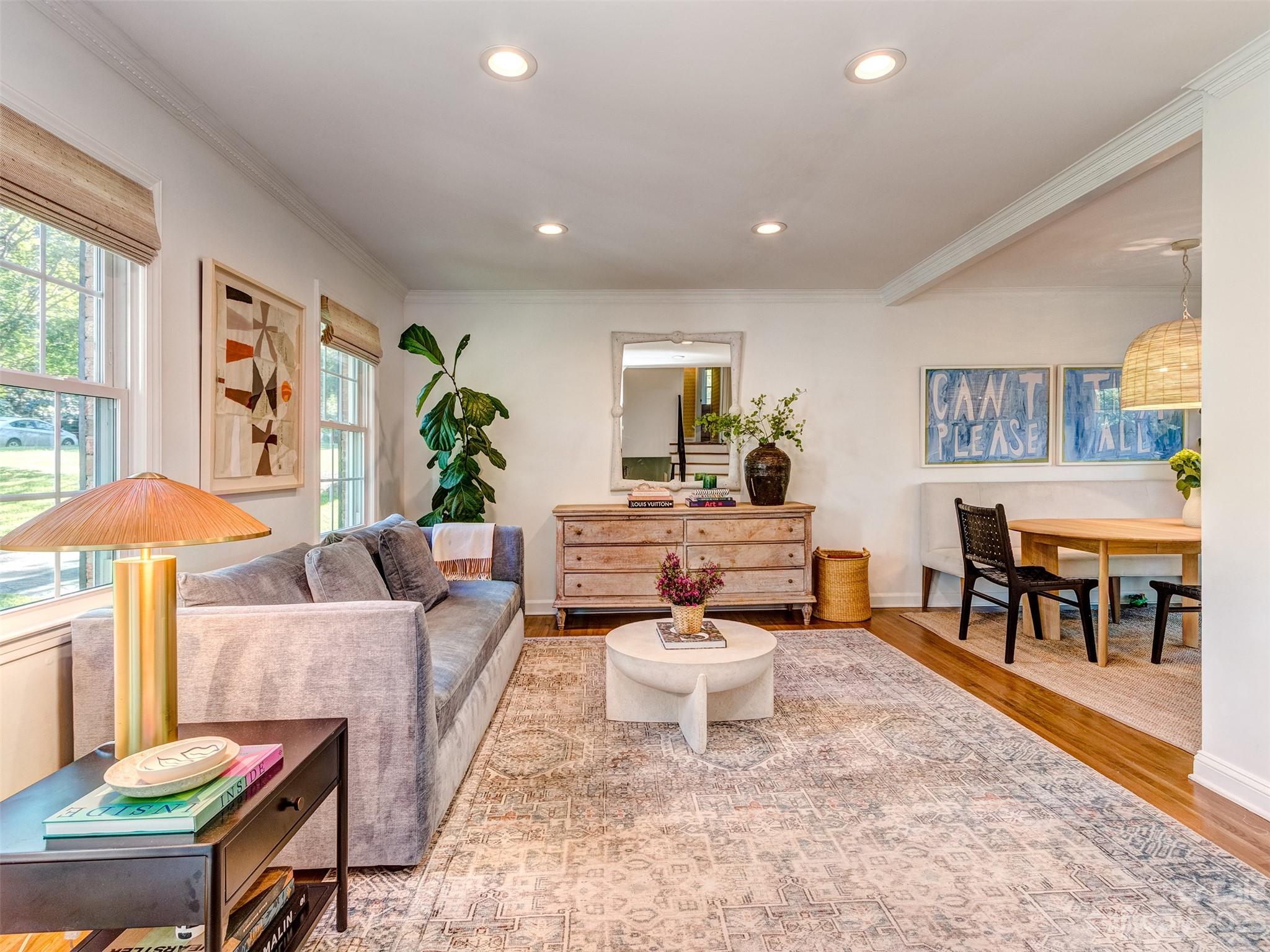 2819 Eastburn Road Charlotte, NC 28210 - Photo 5 of 34 a living room with furniture and a dining table with kitchen view