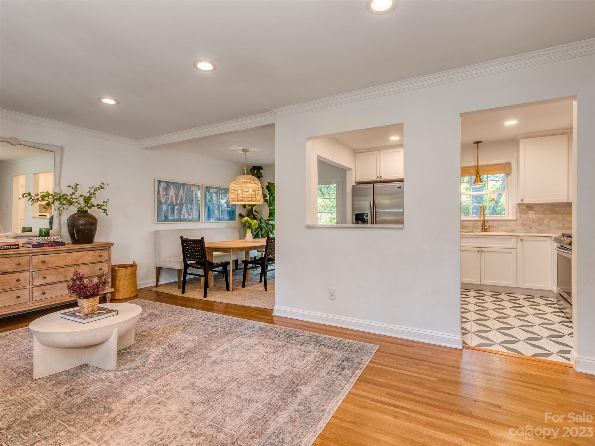 2819 Eastburn Road Charlotte, NC 28210 - Photo 6 of 34 a living room with furniture and a wooden floor