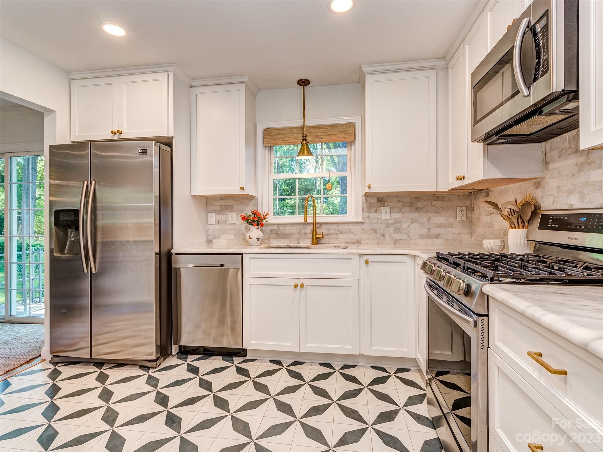 2819 Eastburn Road Charlotte, NC 28210 - Photo 8 of 34 a kitchen with a stove a sink and a refrigerator