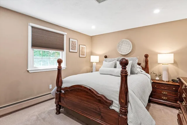 a bed room with a bed and window