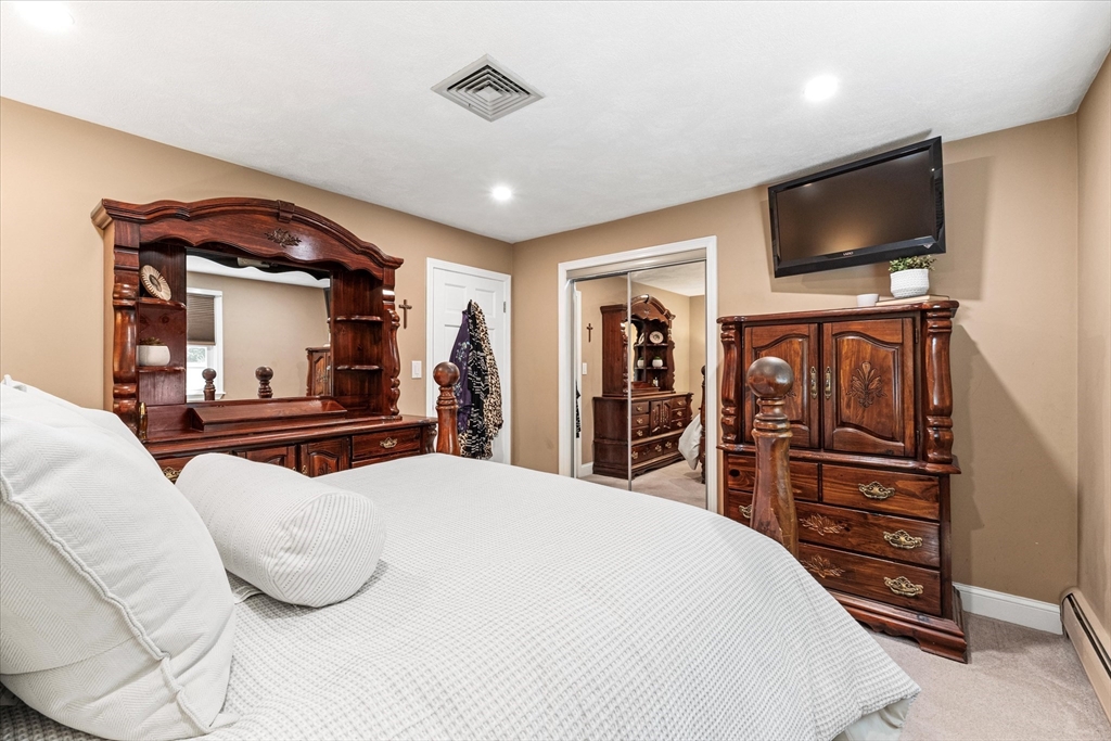 42 Crescent Saugus Ma Saugus, MA 01906 - Photo 14 of 38 a bedroom with a bed and a flat screen tv