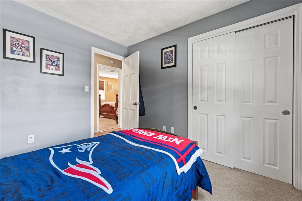 42 Crescent Saugus Ma Saugus, MA 01906 - Photo 18 of 38 a bedroom with a bed and a painting on the wall