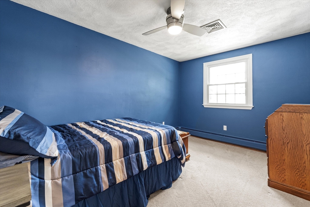 42 Crescent Saugus Ma Saugus, MA 01906 - Photo 20 of 38 a bedroom with a bed and window