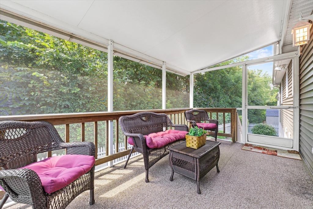 42 Crescent Saugus Ma Saugus, MA 01906 - Photo 26 of 38 a living room with furniture and a floor to ceiling window
