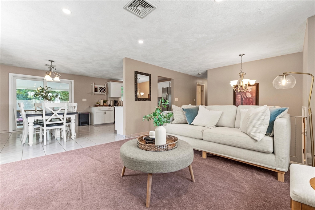 42 Crescent Saugus Ma Saugus, MA 01906 - Photo 10 of 38 a living room with furniture and a dining table