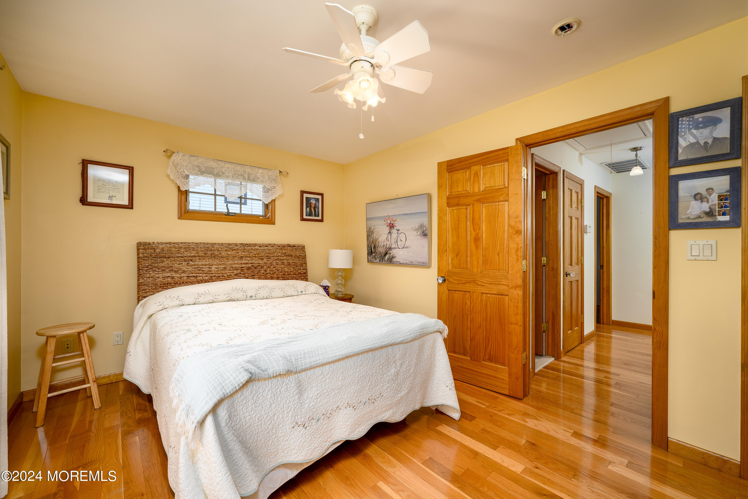 8 Parkview Drive Hazlet, NJ 07730 - Photo 17 of 40 a spacious bedroom with a bed and a chandelier