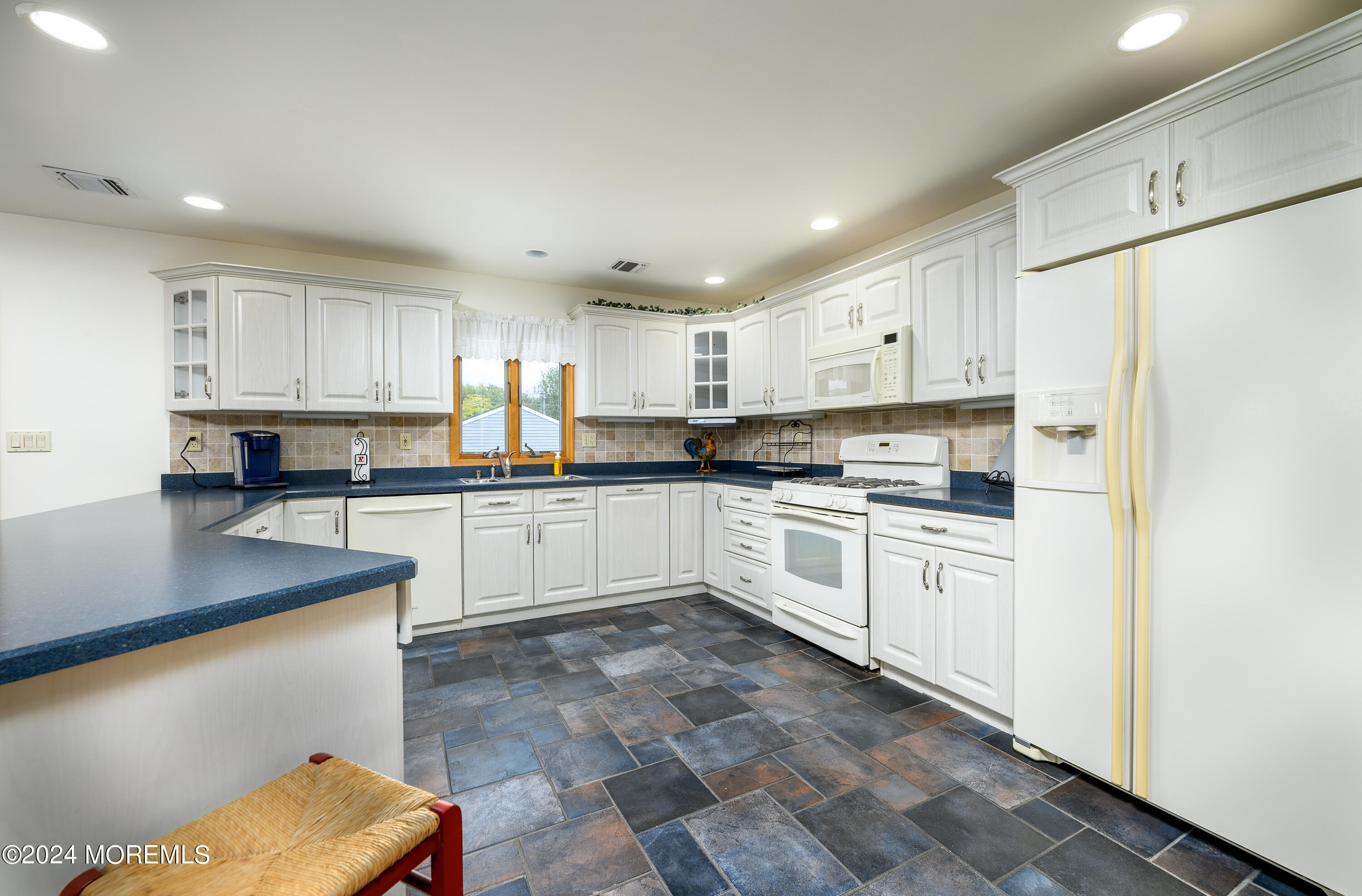 8 Parkview Drive Hazlet, NJ 07730 - Photo 9 of 40 a kitchen with granite countertop white cabinets and white appliances