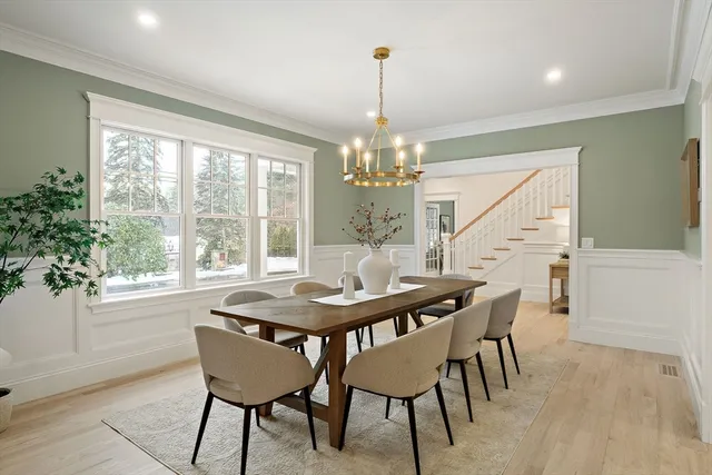 a kitchen with white cabinets and a sink